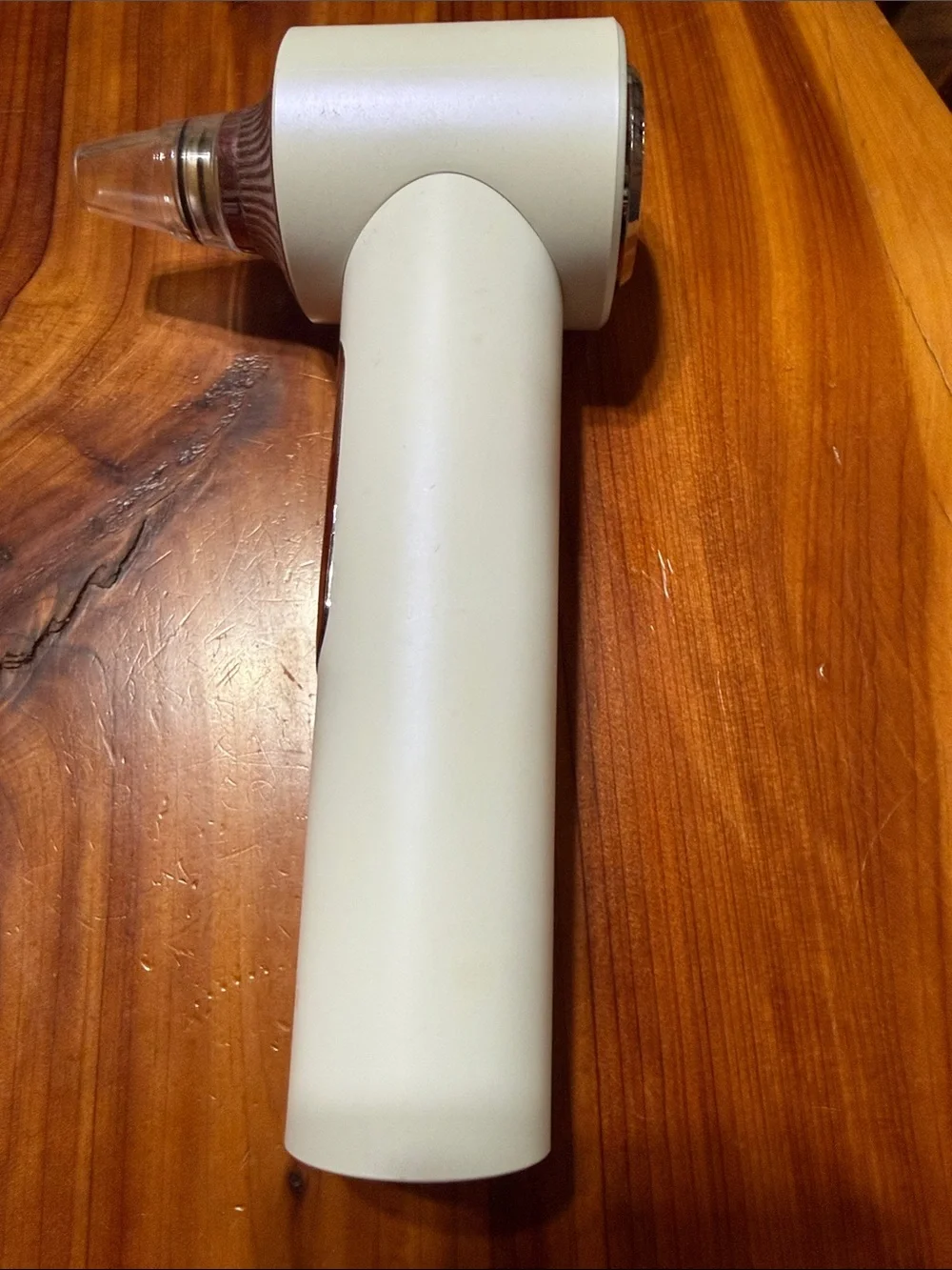 Fancii White & Rose Gold Facial Pore Vacuum and light therapy tool.